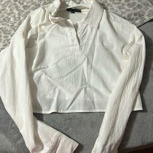 selling this white type of crop top. I bought it from Pacsun.